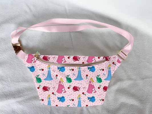 Pink crossbody bag with princess pattern print